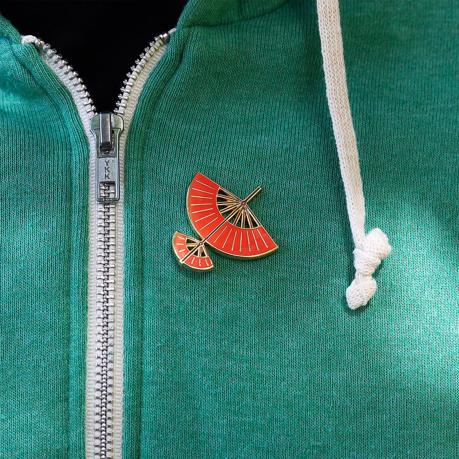Avatar Aang Glider Enamel pin pinned on a green sweater